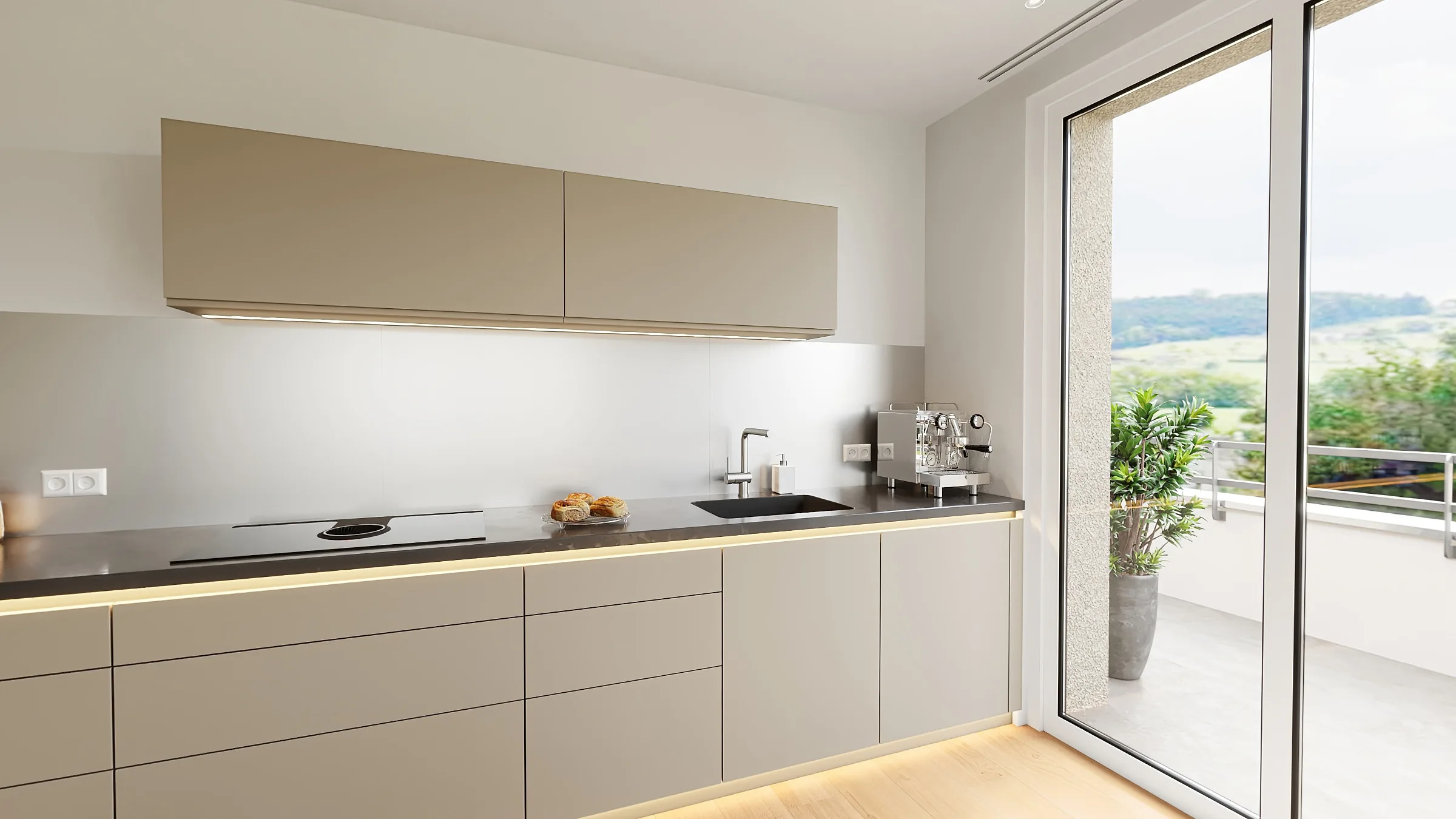 Kitchen along the wall in the larger apartment